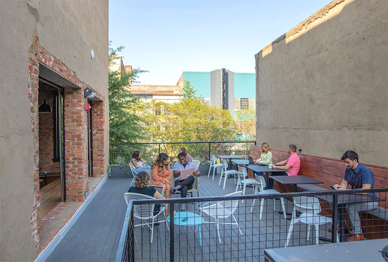 gather-arts-office Group of diverse workers on a rooftop outdoor deck, Richmond, VA